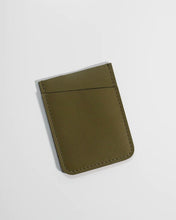 Load image into Gallery viewer, the Small Hours Slim Leather Card Holder in Olive laying flat tilted on an angle against a white background
