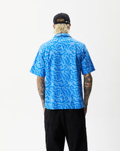 Load image into Gallery viewer, back view of the Afends Men&#39;s Icebergs Short Sleeve Shirt in Arctic on a model posing with his hands by his sides
