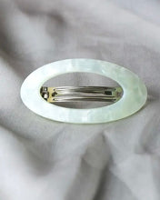Load image into Gallery viewer, the Horace Maria Hair Clip in mint shot from above laying on grey fabric
