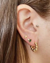 Load image into Gallery viewer, the Horace Gemma Stud Earring shown in an ear in the third piercing along with a hoop earring in the first hole and stud in the second
