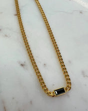 Load image into Gallery viewer, the Horace Nero Necklace laying flat on a marble surface
