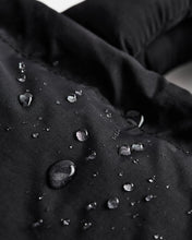Load image into Gallery viewer, a close up of the Ölend Mini Ona Soft Bag covered in water droplets demonstrating its water resistance
