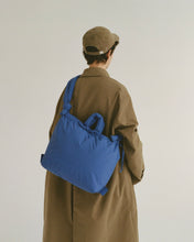 Load image into Gallery viewer, the Ölend Ona Soft Bag in cobalt blue worn crossbody by a model and shot from the back

