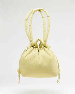 the Ölend Ona Soft Bag in lime floating over a neutral background