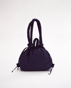 the Ölend Ona Soft Bag in navy stuffed and sitting against a neutral background