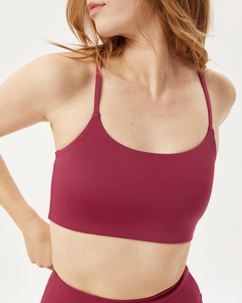 close up view of the front of the Girlfriend Collective Ultralight Juliet Bra in Rhododendron on a model