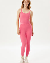 Load image into Gallery viewer, the Girlfriend Collective High-Rise Crop Legging in Camellia worn by a model
