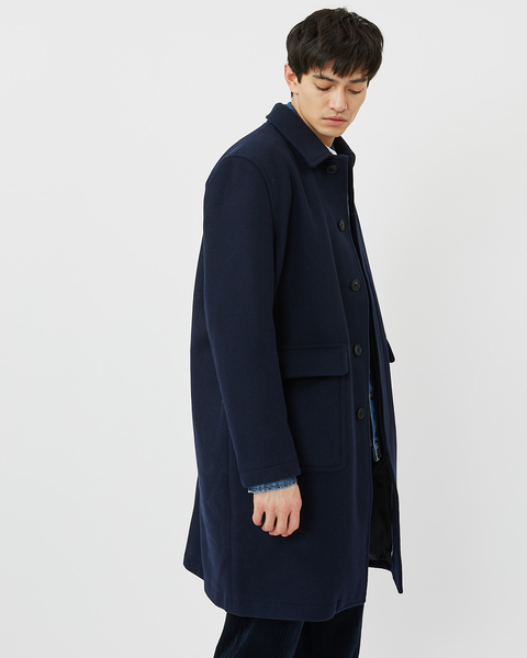 Side view of Minimum Men's Balano Coat in Navy Blazer on model