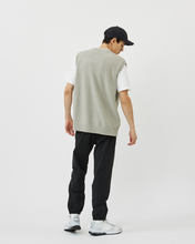 Load image into Gallery viewer, Back view of the Minimum Men's Vastar Vest in Ghost Grey worn with a white tee, black pants and white sneakers