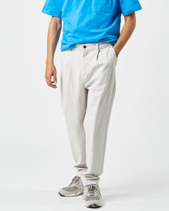 the Minimum Men's Bertils Pant in Vapor Blue on a model posing with his hand in his pocket