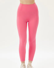 Load image into Gallery viewer, close up of the front of the Girlfriend Collective High-Rise Crop Legging in Camellia on a model