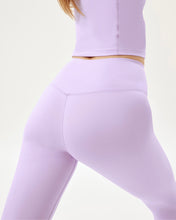 Load image into Gallery viewer, close up of the back of the Girlfriend Collective Ultralight Crop Legging in Bellflower on a model
