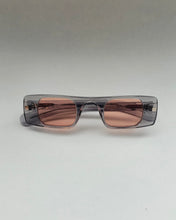 Load image into Gallery viewer, the Spitfire Cut Seven Sunglasses in grey and rose laying on a neutral background