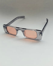 Load image into Gallery viewer, the Spitfire Cut Seven Sunglasses in grey with pink lens on an angle against a neutral background
