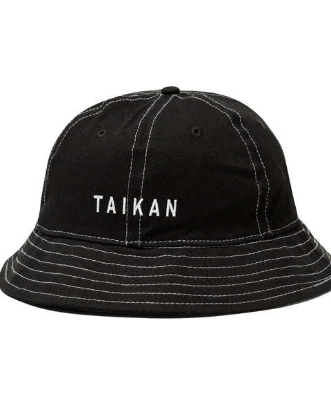 the Taikan Bell Bucket Hat in Black Contrast against a white background