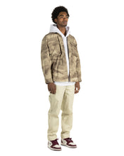 Load image into Gallery viewer, the Taikan Shirt Jacket in Abstract Camo on a model standing at an angle
