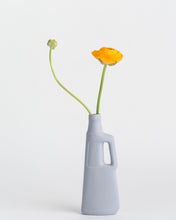 Load image into Gallery viewer, Middle Kingdom Revolver Bottle Vase in lilac grey with yellow flower
