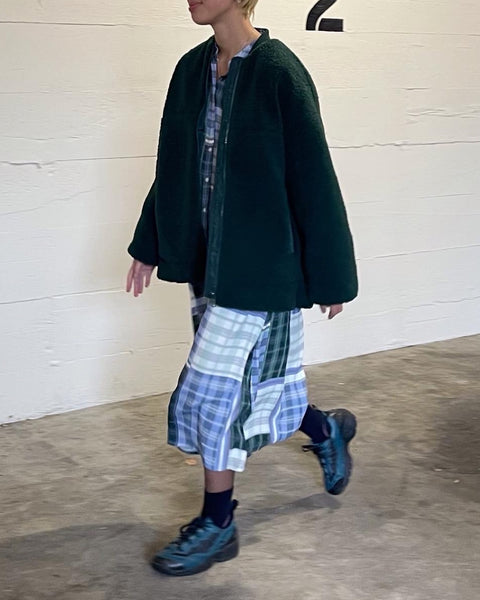 Minimum Women's Bavory Jacket in Pine Grove worn by a model over a plaid skirt and matching top