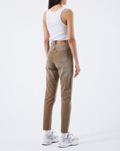 Load image into Gallery viewer, back angled view of model wearing the Dr. Denim Women&#39;s Nora Jean in Washed Nougat with sneakers and a white rib tank top

