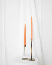 Load image into Gallery viewer, a pair of Socco Designs Taper Candles in peach in two tapers of varying heights against a white sheet background
