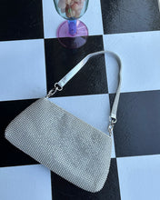 Load image into Gallery viewer, the Crystal Clutch Bag in Silver laying flat on a checkerboard background
