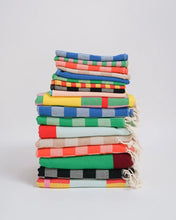 Load image into Gallery viewer, colourful striped turkish towels folded and stacked on top of one another sitting against a neutral background
