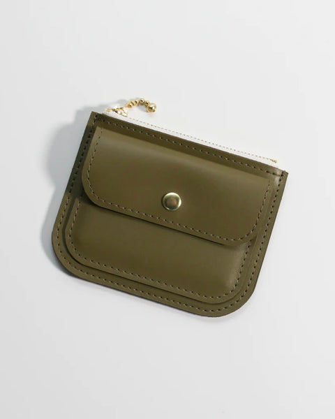 the front of the Small Hours Leather Mini Wallet in Olive laying on an angle against a white background