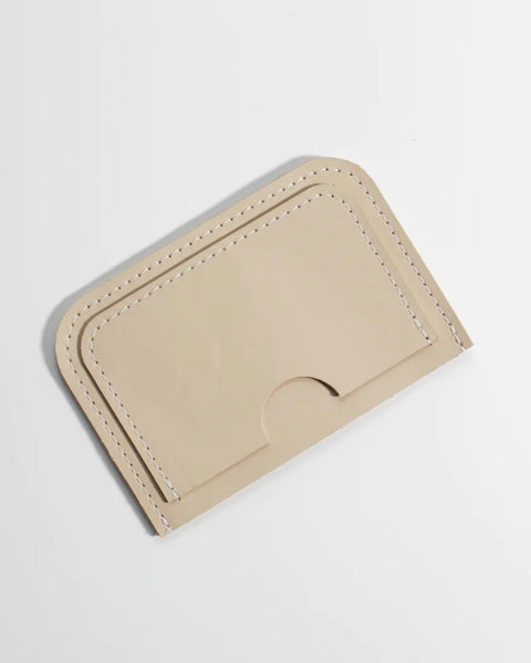 Small Hours Leather Card Case in Almond laying flat on a white background