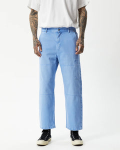 close up of the front of the Afends Men's Richmond Workwear Jean in Faded Arctic on a model posing with his hands at his sides