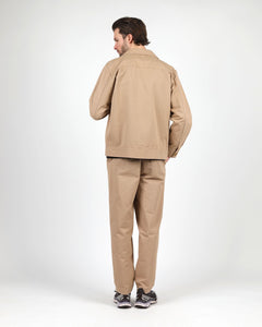 back view of a model wearing the Wemoto Men's Ethan Jacket in Khaki