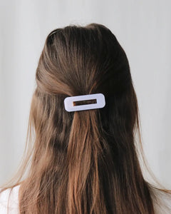 the Horace Fosco Hair Clip shown from the back on a model clipped up in a half up style 