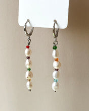 Load image into Gallery viewer, the Horace Bisera pearl and gemstome dangly Earring hanging from a card against a neutral background
