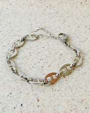 Load image into Gallery viewer, the Horace Roffia stainless steel chain link Bracelet laying flat on a stone background
