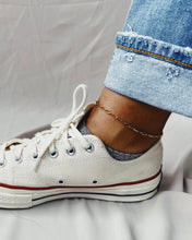 Load image into Gallery viewer, the Horace Zolko Ankle Chain worn by a model paired with white converse sneakers and cuffed jeans
