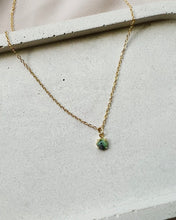 Load image into Gallery viewer, the Horace Zoto green agate Necklace laying on a neutral background

