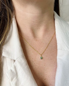 the Horace Zoto green agate Necklace in gold worn around the neck of a model