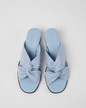 Load image into Gallery viewer, overheard shot of a pair of blue sandals with a knotted front
