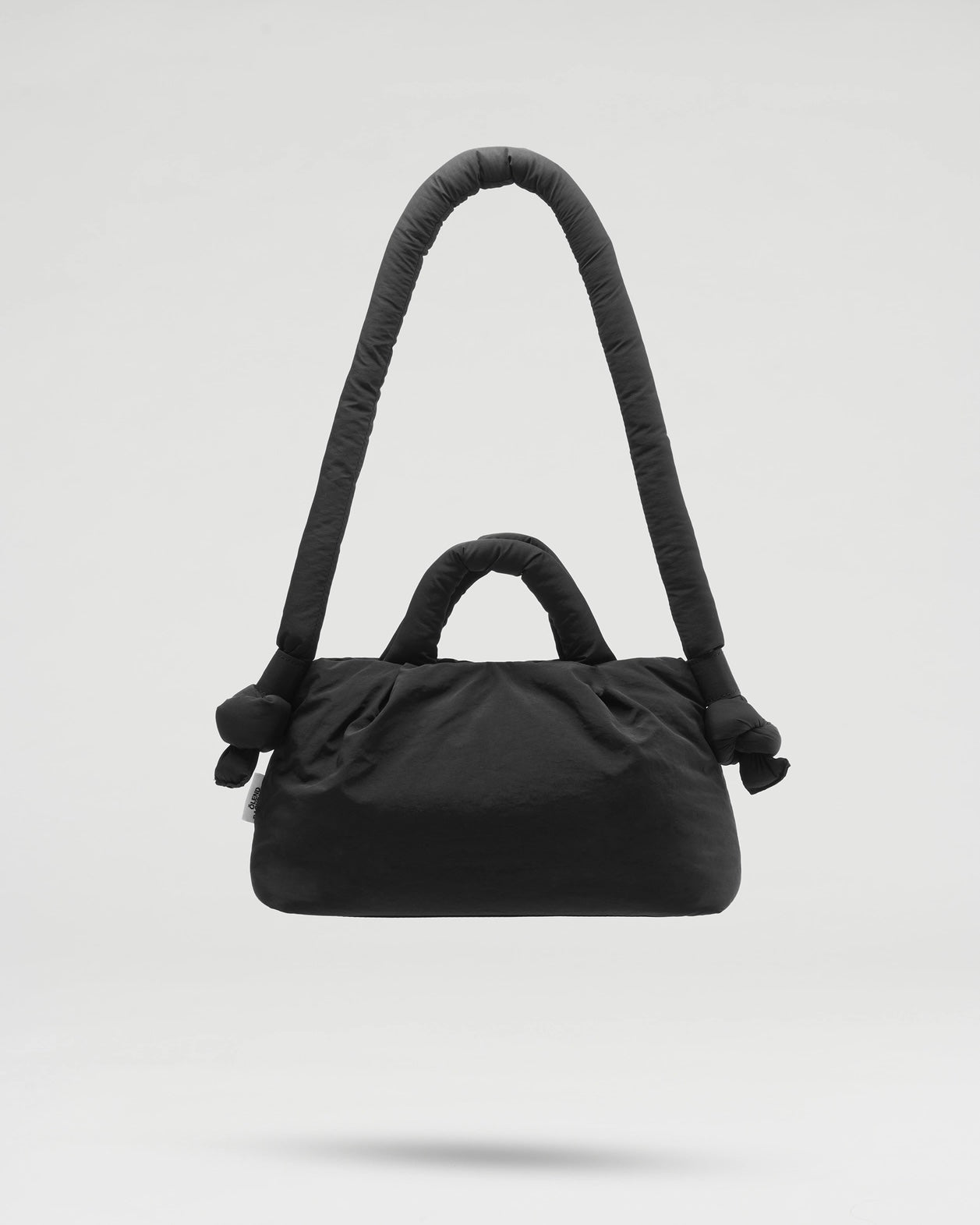 the Ölend Mini Ona Soft Bag in black floating against a neutral background