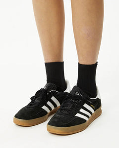 Afends Women's Essential Socks in black on a model worn with adidas gazelles