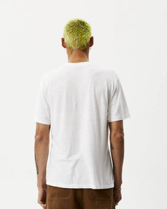 back view of the Afends Men's Classic Hemp Retro Tee in White on a model posing in front of a white background
