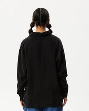 Load image into Gallery viewer, back view of the Afends Women&#39;s Gemma Shirt in Black on a model posing in front of a white background
