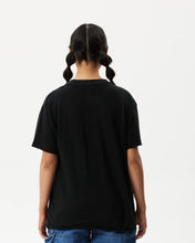 Load image into Gallery viewer, back view of the the Afends Women&#39;s Slay Oversized Tee in Black on a model posing against a white background
