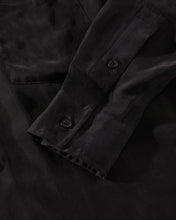 Load image into Gallery viewer, close up of the Afends Women&#39;s Gemma Shirt in Black sleeve detail
