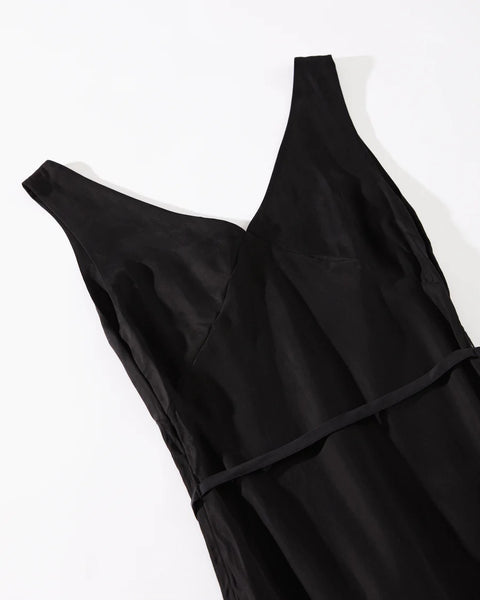 close up of the Afends Women's Gemma Dress in Black laying flat on a white background 