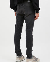 Load image into Gallery viewer, close up of the back angled view of the Dr. Denim Men&#39;s Clark Jean in Cinder on a model standing in front of a neutral background
