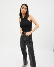Load image into Gallery viewer, the Dr. Denim Women&#39;s Echo Jean in Black Coat Contrast on a model posing with her thumbs in her belt loops against a neutral background
