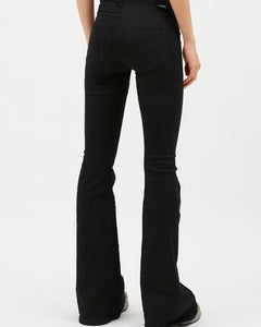 close up of the back view of the Dr. Denim Women's Macy Jean in Black on a model standing in front of a neutral background