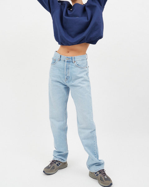 the Dr. Denim Women's Beth Jean in Stream Light Used on a model posing with her hands above her head outside of the frame