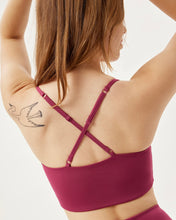 Load image into Gallery viewer, close up view of the back of the Girlfriend Collective Ultralight Juliet Bra in Rhododendron on a model
