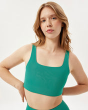 Load image into Gallery viewer, model wearing the Girlfriend Collective Tommy Bra in Saguaro 

